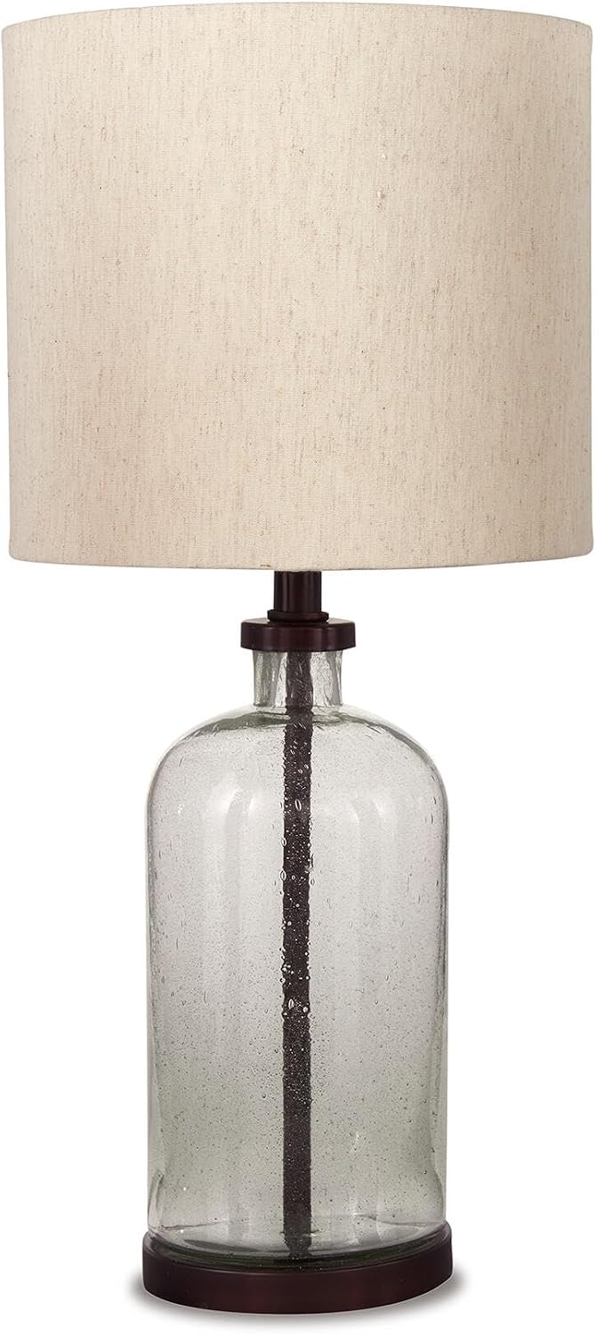 Signature Design by Ashley Bandile Seeded Glass Bedside Table Lamp, Bronze | Textured clear glass base, Light fabric drum shade, Modern farmhouse style, Living room reading spaces