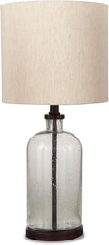 Signature Design by Ashley Bandile Seeded Glass Bedside Table Lamp, Bronze | Textured clear glass base, Light fabric drum shade, Modern farmhouse style, Living room reading spaces