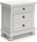 Signature Design by Ashley Tall Antique White Nightstand Wood Bedside Table | Two dovetail drawers, Hidden pull-out tray for valuables, Textured antiqued white oak finish, Robbinsdale Series