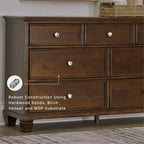 Signature Design by Ashley Traditional 7 Drawer Dresser, Dark Cherry | 62-inch wide dresser made of hardwood solids, birch veneer and MDF substrate, Dark cherry wood finish, Danabrin Series