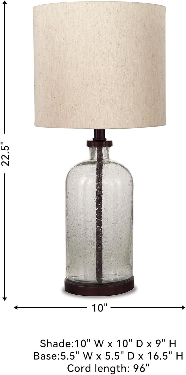 Signature Design by Ashley Bandile Seeded Glass Bedside Table Lamp, Bronze | Textured clear glass base, Light fabric drum shade, Modern farmhouse style, Living room reading spaces