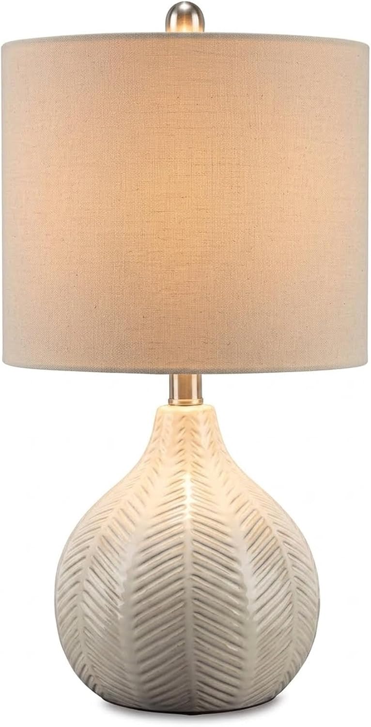 Signature Design by Ashley Rainermen Ceramic Table Lamp, 21", Off White | Textured herringbone base, Transparent white glaze, Hardback fabric drum shade, Bedside use, 92.5-inch cord, E26 socket