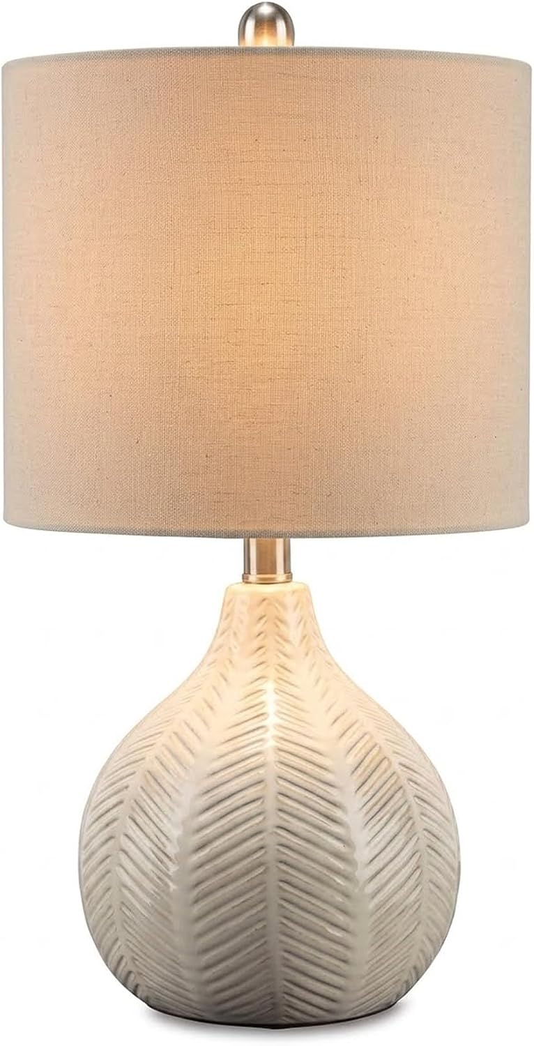 Signature Design by Ashley Rainermen Ceramic Table Lamp, 21", Off White | Textured herringbone base, Transparent white glaze, Hardback fabric drum shade, Bedside use, 92.5-inch cord, E26 socket