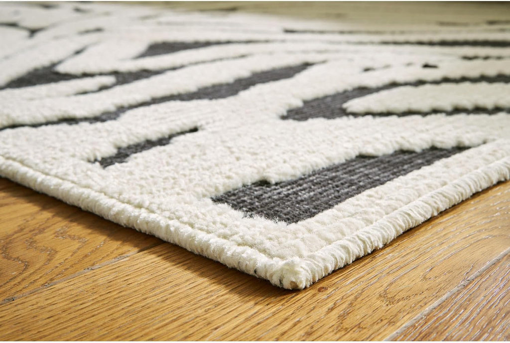 Signature Design by Ashley Thomwith Contemporary Indoor Washable Zebra Design 8 x 10 Rug with Non Slip Backing, Black & White