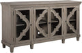 Signature Design by Ashley Fossil Ridge 4-Door Accent Cabinet, Gray | Solid and engineered wood, Tempered glass inlays, Quatrefoil fretwork pattern, 3 adjustable shelves, 76 in width