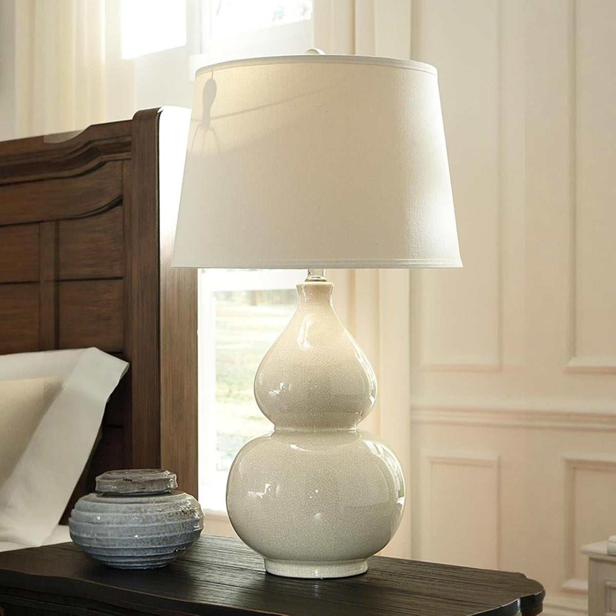Signature Design by Ashley Saffi 30" Tall Ceramic Table Lamp, Cream | Textured crackle glaze ceramic base, Adjustable 3-way switch for custom ambiance, Light-diffusing fabric drum shade