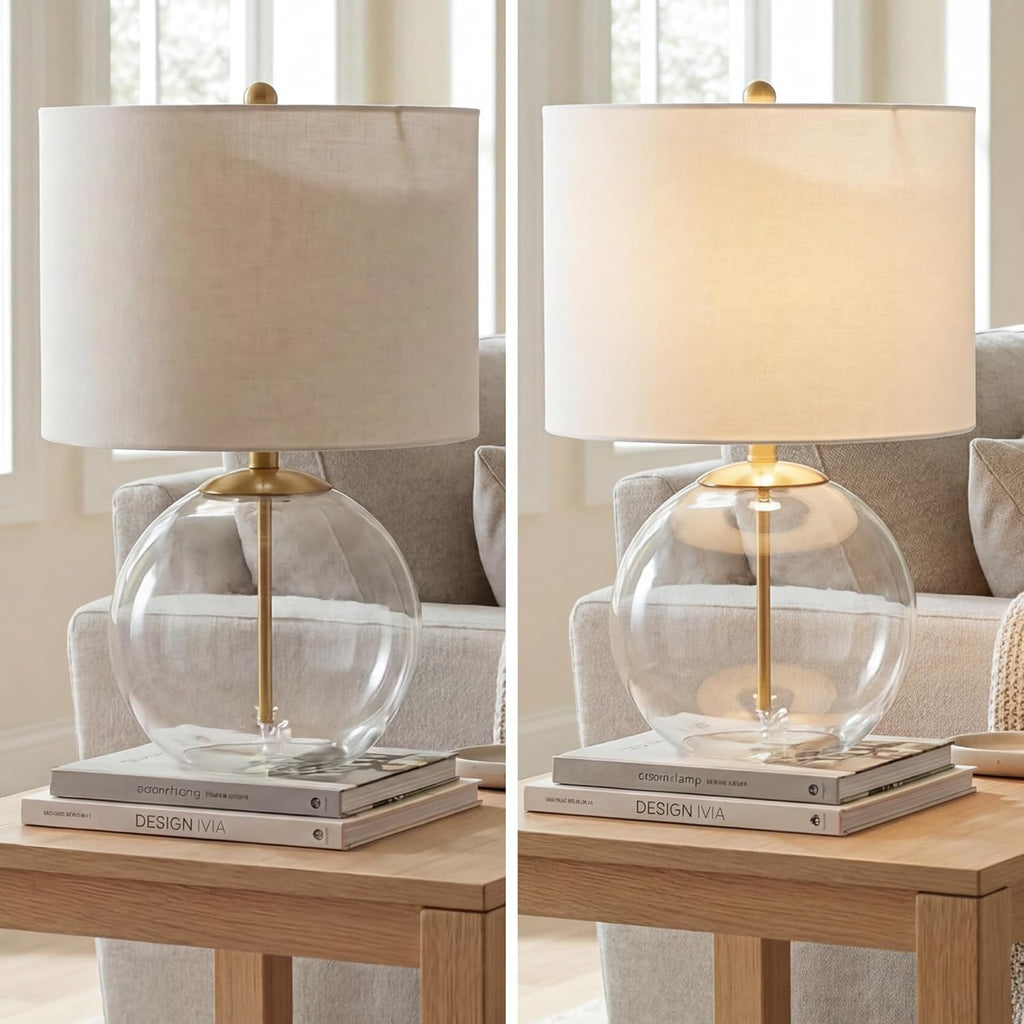 Signature Design by Ashley Glass Table Lamp, Modern Bedside, Clear & Brass | White fabric drum shade, Compact round clear glass profile for modern nightstands, Samder Series