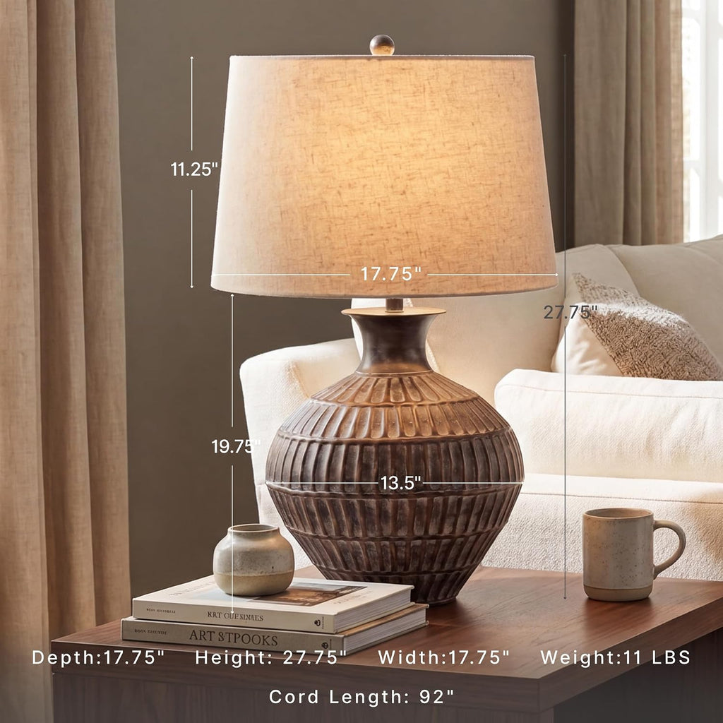 Signature Design by Ashley Magan Metal Table Lamp, 28", Antique Bronze | Antique bronze-tone metal base, Textured pattern, Fabric modified drum shade, Living room or entryway use, 3-way switch