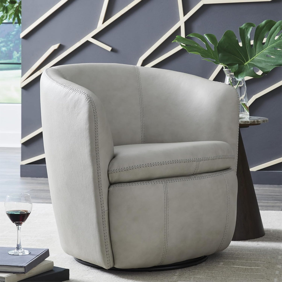 Signature Design by Ashley Kierreys Leather Swivel Barrel Chair, Bone | 100% top grain leather upholstery, 360-degree metal base rotation, Engineered wood and metal frame, Contemporary barrel back