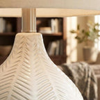 Signature Design by Ashley Rainermen Ceramic Table Lamp, 21", Off White | Textured herringbone base, Transparent white glaze, Hardback fabric drum shade, Bedside use, 92.5-inch cord, E26 socket