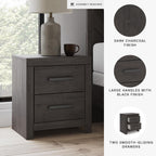 Signature Design by Ashley 2 Drawer Grey Nightstand, Charcoal, Prendonea | Engineered wood with decorative laminate, Smooth-gliding drawers, Replicated oak texture, Sturdy 41 lb solid frame