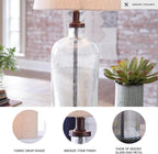 Signature Design by Ashley Bandile Seeded Glass Bedside Table Lamp, Bronze | Textured clear glass base, Light fabric drum shade, Modern farmhouse style, Living room reading spaces
