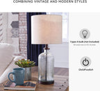 Signature Design by Ashley Bandile Seeded Glass Bedside Table Lamp, Bronze | Textured clear glass base, Light fabric drum shade, Modern farmhouse style, Living room reading spaces