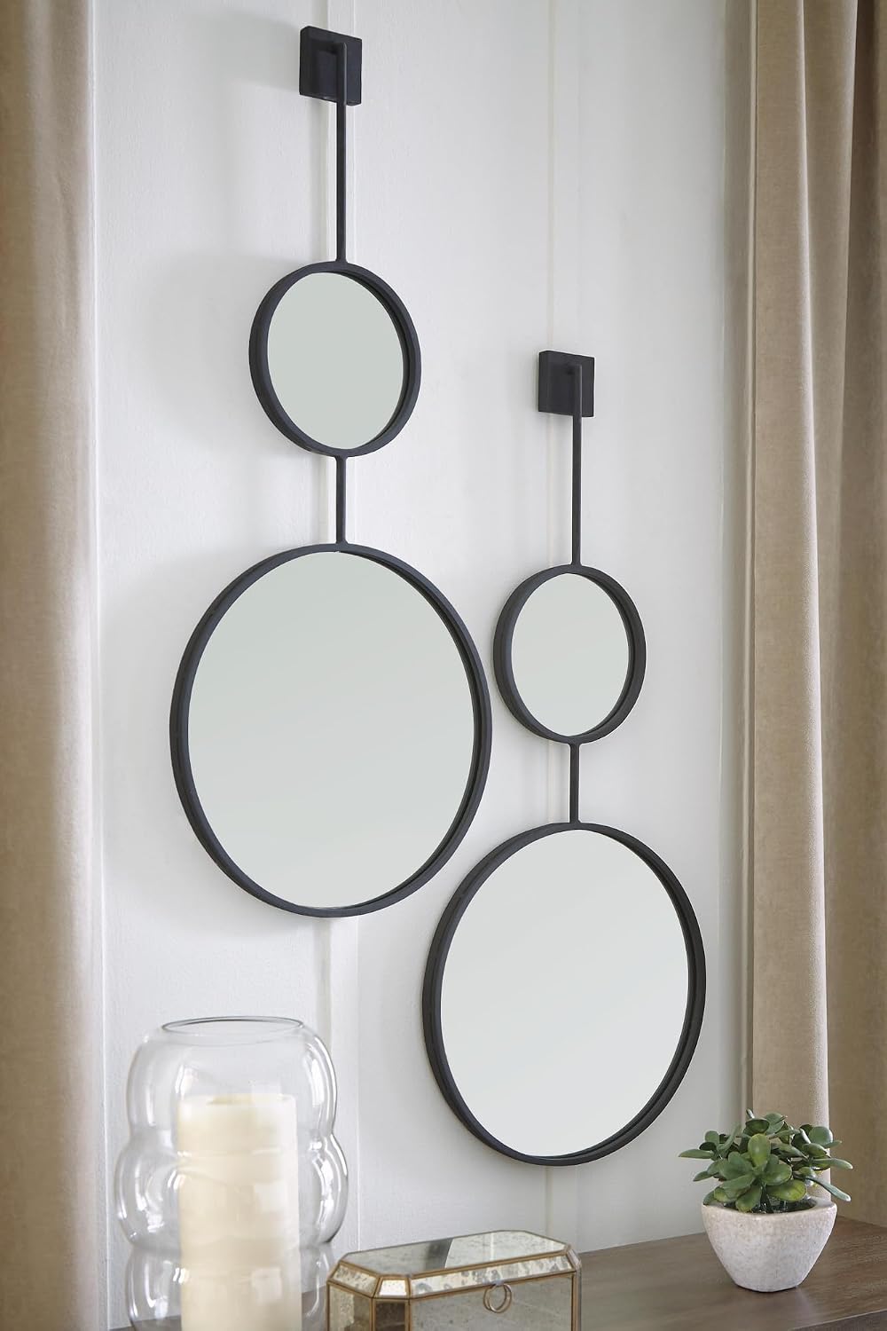 Signature Design by Ashley Large Stacked Round Accent Wall Mirror, Black | Geometric stacked circles in a textured black metal frame, Long skinny rounded mirror for narrow entryways, Brewer Series