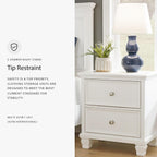 Signature Design by Ashley Fortman White Nightstand, 2 Drawer Storage, Hardwood Solids and MDF Construction, Traditional Wood Bedside Table, 25" W | Hardwood solids and MDF substrate, Smooth-gliding closed storage, Ideal for master and guest rooms