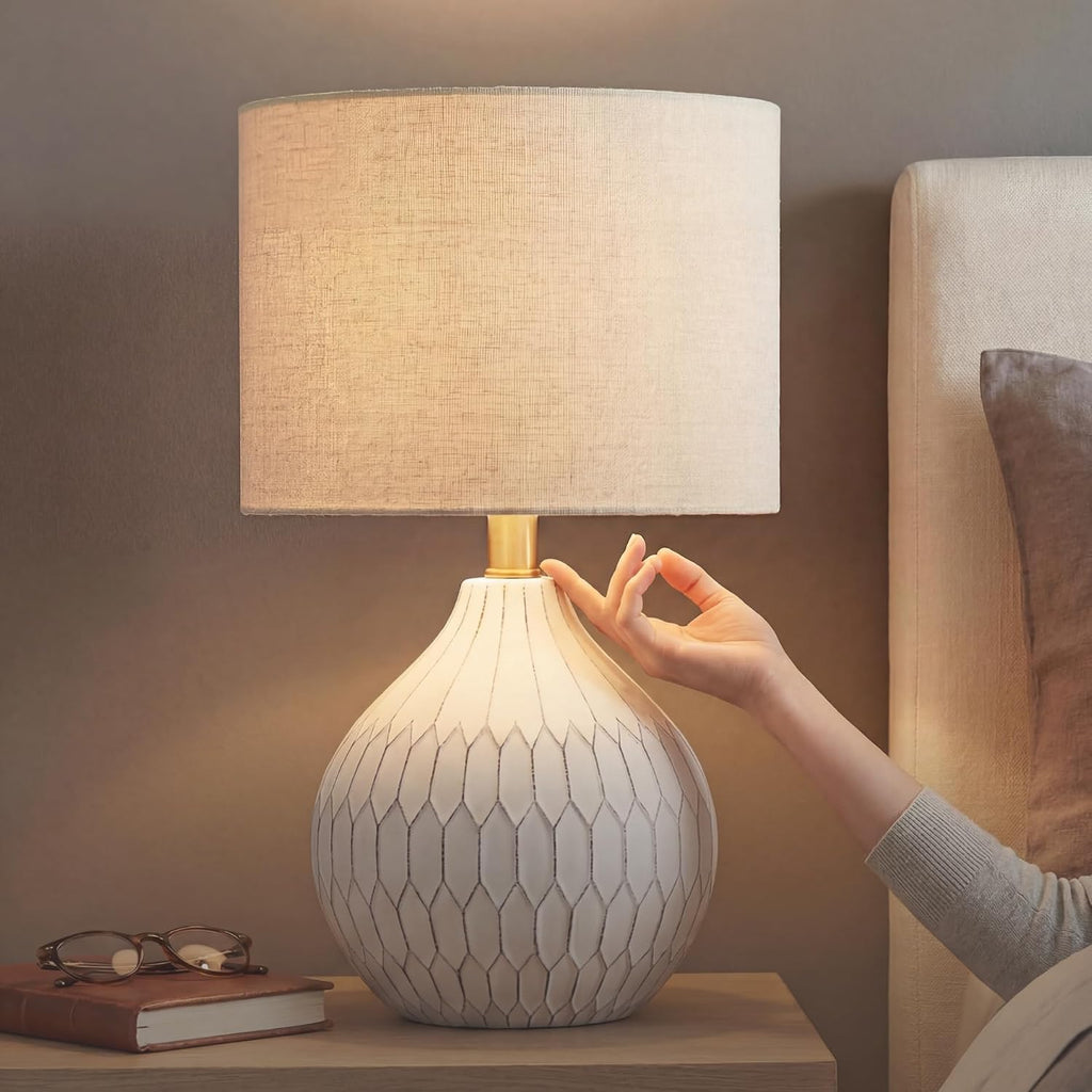 Signature Design by Ashley Ceramic Table Lamp, Bedside, Antique White | Textured wave ceramic base, Compact 18-inch height ideal for bedside nightstands and transitional styling, Wardmont Series