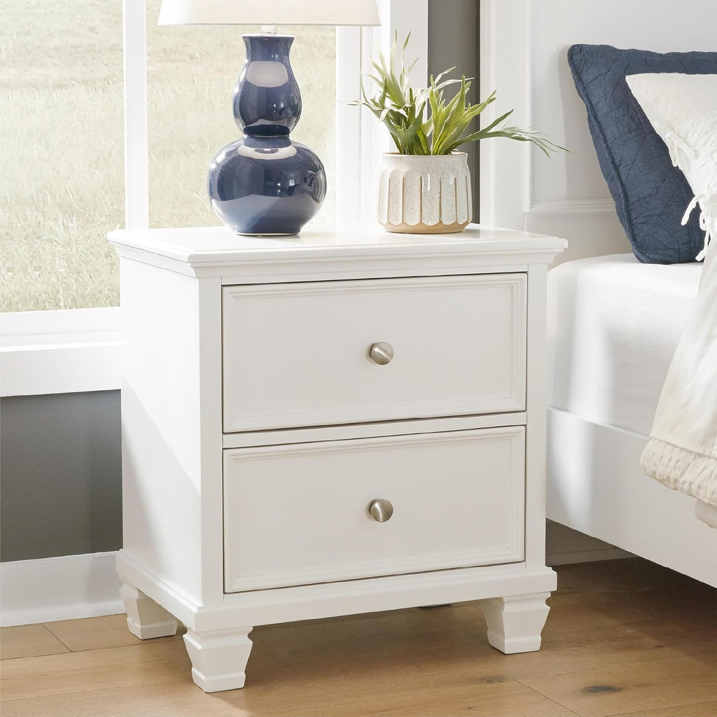 Signature Design by Ashley Fortman White Nightstand, 2 Drawer Storage, Hardwood Solids and MDF Construction, Traditional Wood Bedside Table, 25" W | Hardwood solids and MDF substrate, Smooth-gliding closed storage, Ideal for master and guest rooms