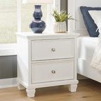 Signature Design by Ashley Fortman White Nightstand, 2 Drawer Storage, Hardwood Solids and MDF Construction, Traditional Wood Bedside Table, 25" W | Hardwood solids and MDF substrate, Smooth-gliding closed storage, Ideal for master and guest rooms