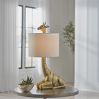 Signature Design by Ashley Giraffe Table Lamp, Goldtone Safari Animal Lamp | Sturdy goldtone polyresin base, Cotton and polyester drum hardback fabric shade, 25-inch tall modern safari style, Ferrison