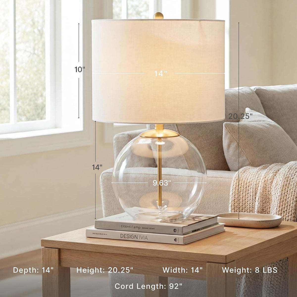 Signature Design by Ashley Glass Table Lamp, Modern Bedside, Clear & Brass | White fabric drum shade, Compact round clear glass profile for modern nightstands, Samder Series