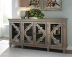 Signature Design by Ashley Fossil Ridge 4-Door Accent Cabinet, Gray | Solid and engineered wood, Tempered glass inlays, Quatrefoil fretwork pattern, 3 adjustable shelves, 76 in width