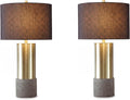 Signature Design by Ashley Jacek Contemporary Table Lamp Set of 2 | Textured faux concrete and brass-finished metal, Black drum shade with goldtone foil interior, Living room and bedside use