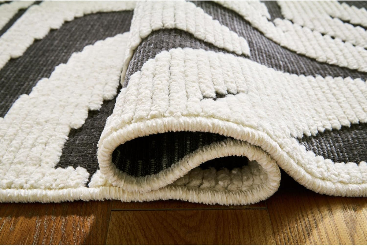 Signature Design by Ashley Thomwith Contemporary Indoor Washable Zebra Design 8 x 10 Rug with Non Slip Backing, Black & White