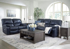 Signature Design by Ashley Leesworth Power Reclining Loveseat, Ocean Blue | Space-saving zero wall design, Top grain leather touchpoints, Built-in zero-draw USB ports, 32 in minimum doorway width