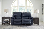 Signature Design by Ashley Leesworth Power Reclining Loveseat, Ocean Blue | Space-saving zero wall design, Top grain leather touchpoints, Built-in zero-draw USB ports, 32 in minimum doorway width