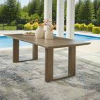 Signature Design by Ashley Serene Bay 6-Person Outdoor Dining Table | 84-inch rectangular patio dining table with wood-look finish, Rust-resistant aluminum frame, Built-in umbrella hole