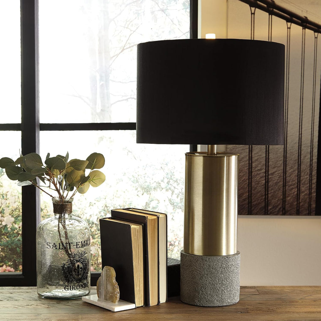 Signature Design by Ashley Jacek Contemporary Table Lamp Set of 2 | Textured faux concrete and brass-finished metal, Black drum shade with goldtone foil interior, Living room and bedside use