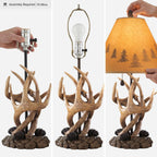 Signature Design by Ashley Derek Rustic Table Lamps, Living Room, Set of 2 | Durable poly resin antler base, Warm translucent paper silhouette shade projecting forest scenes, Rustic cabin style