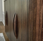 Signature Design by Ashley Mango Wood Accent Cabinet with Doors, Sideboard | Heavyweight construction in rich dark brown, Elegant vertical fluting, Curved sides, Wire management, Amickly Series