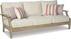 Signature Design by Ashley Clare View 1-Piece Eucalyptus Outdoor Sofa | Weather-shielded 5-step eucalyptus finish, Stain-resistant Nuvella fabric, Deep-seated 3-person frame with 4 accent pillows