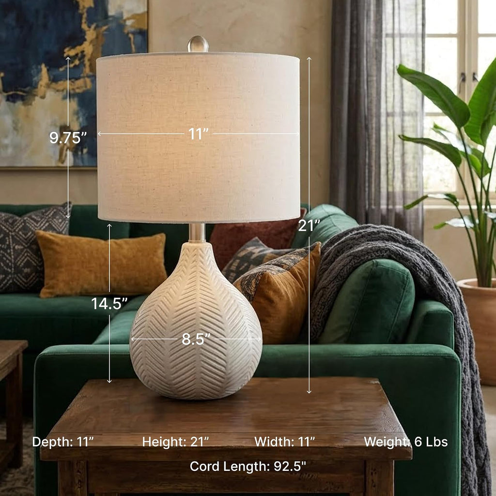 Signature Design by Ashley Rainermen Ceramic Table Lamp, 21", Off White | Textured herringbone base, Transparent white glaze, Hardback fabric drum shade, Bedside use, 92.5-inch cord, E26 socket