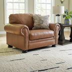 Signature Design by Ashley Carianna Oversized Leather Accent Chair, Caramel | Top-grain leather seating, Durable faux leather outer panels, Extra-wide 54 in frame, Traditional living room style