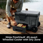 Ninja FrostVault™ 45qt Cooler with Wheels, Dry Storage, Charcoal Gray | Ninja FrostVault's 45-qt capacity holds 68 cans, keeps food cool & dry, and rolls easily on all-terrain wheels
