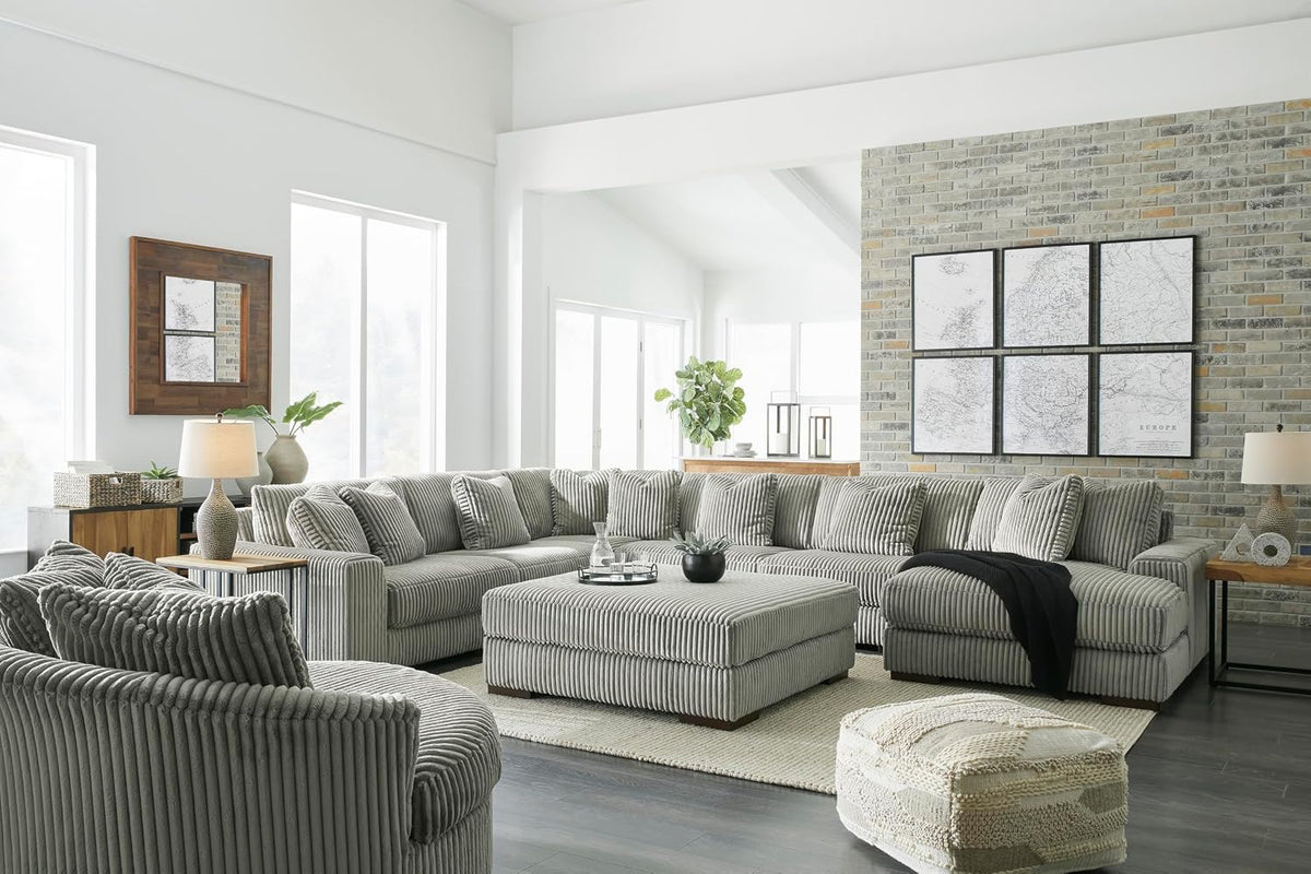 Signature Design by Ashley Lindyn Oversized Round Swivel Accent Chair, Fog | Plush textured cord upholstery, Sag-resistant platform foundation, Reversible seat cushion, No assembly required