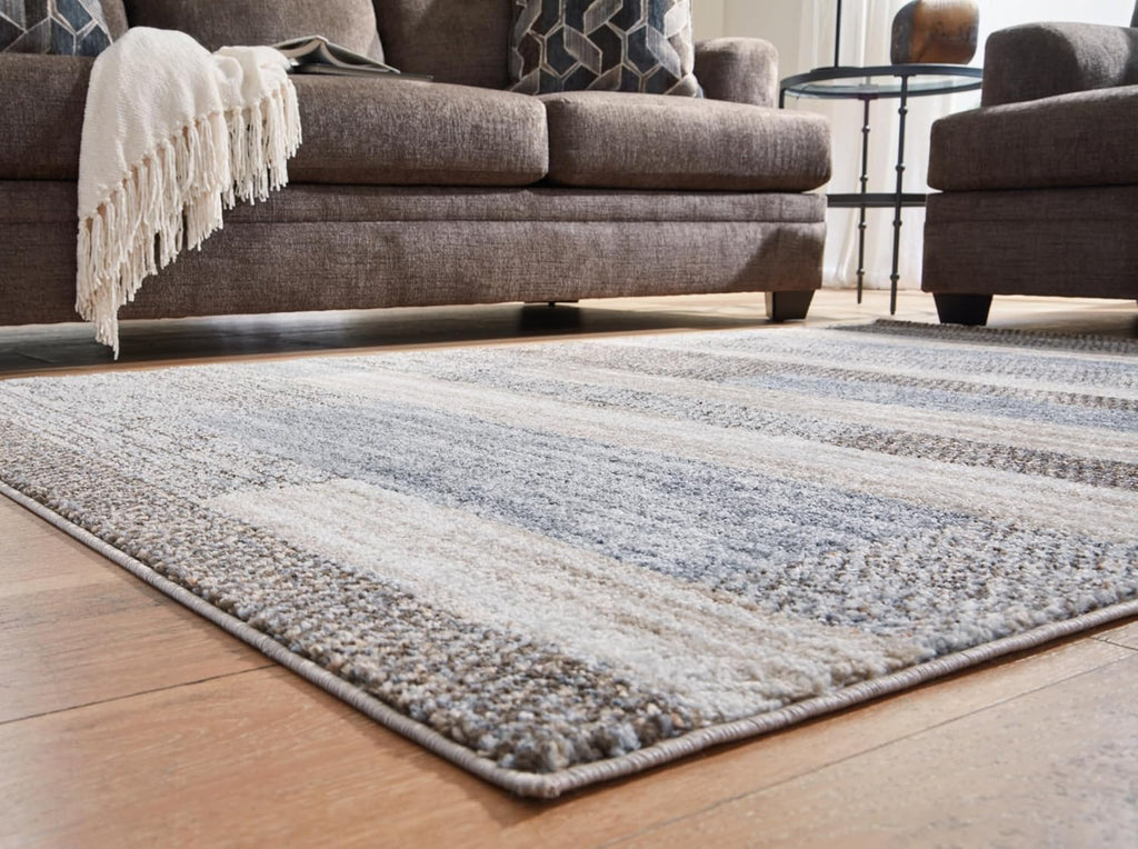 Signature Design by Ashley Sethburn Striped Area Rug 5x7, Cream/Gray | Machine-woven 100% polypropylene, Natural jute backing, Casual modern style, Indoor living spaces, Bedrooms