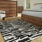 Signature Design by Ashley Bramshaw Area Rug, 5x7, Black and White | Soft 9 mm pile for underfoot comfort, High-contrast abstract pattern, Durable machine-woven polyester