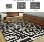 Signature Design by Ashley Bramshaw Area Rug, 5x7, Black and White | Soft 9 mm pile for underfoot comfort, High-contrast abstract pattern, Durable machine-woven polyester