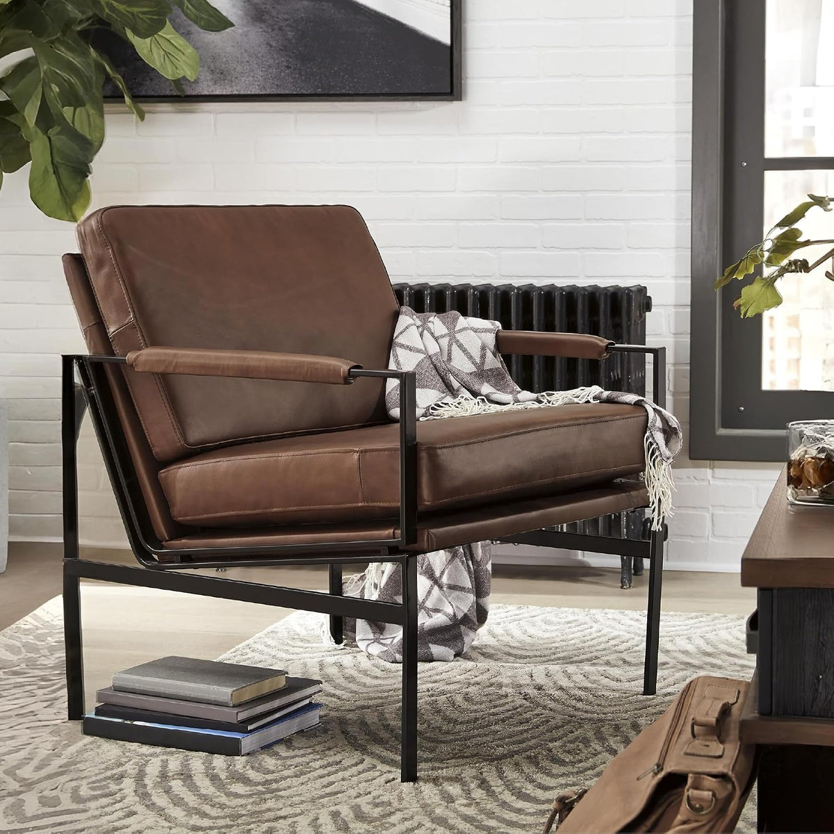 Signature Design by Ashley Puckman Accent Chair, Brown Leather Armchair | Leather and faux leather blend, Bronze-tone metal frame, 26-in wide seat, Upholstered track arms, Living room use