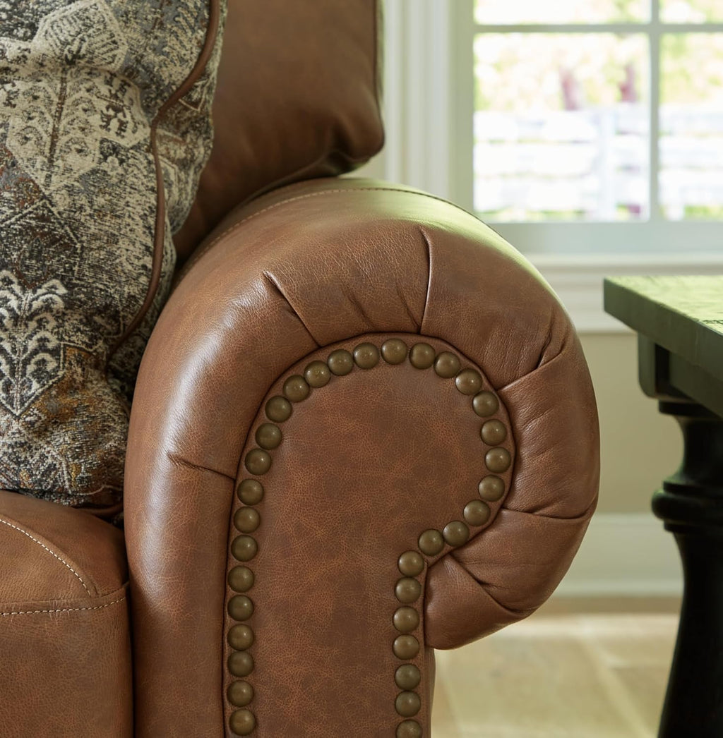Signature Design by Ashley Carianna Oversized Leather Accent Chair, Caramel | Top-grain leather seating, Durable faux leather outer panels, Extra-wide 54 in frame, Traditional living room style