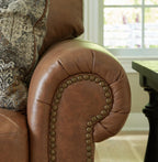 Signature Design by Ashley Carianna Oversized Leather Accent Chair, Caramel | Top-grain leather seating, Durable faux leather outer panels, Extra-wide 54 in frame, Traditional living room style