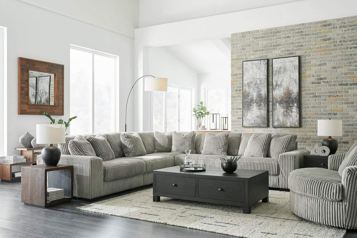 Signature Design by Ashley Lindyn Oversized Round Swivel Accent Chair, Fog | Plush textured cord upholstery, Sag-resistant platform foundation, Reversible seat cushion, No assembly required
