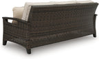 Signature Design by Ashley Drakes Beach 3-Seat Outdoor Sofa, Brown Wicker | Sturdy aluminum frame, Woven-look dark brown resin wicker, Bleach cleanable Nuvella fabric, 4 throw pillows included