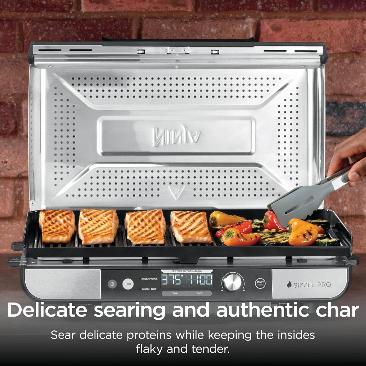 Ninja® Sizzle™ Pro XL 20'' Indoor Griddle & Grill, Silver, GX101 | 40% larger cooking surface, ProTemp IQ edge-to-edge heat, ceramic nonstick plates, detachable ventilated lid, grease control.