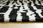 Signature Design by Ashley Bramshaw Area Rug, 8x10, Black and Ivory | Plush 9 mm medium-pile polyester, Protective woven cotton backing, Contemporary high-contrast pattern