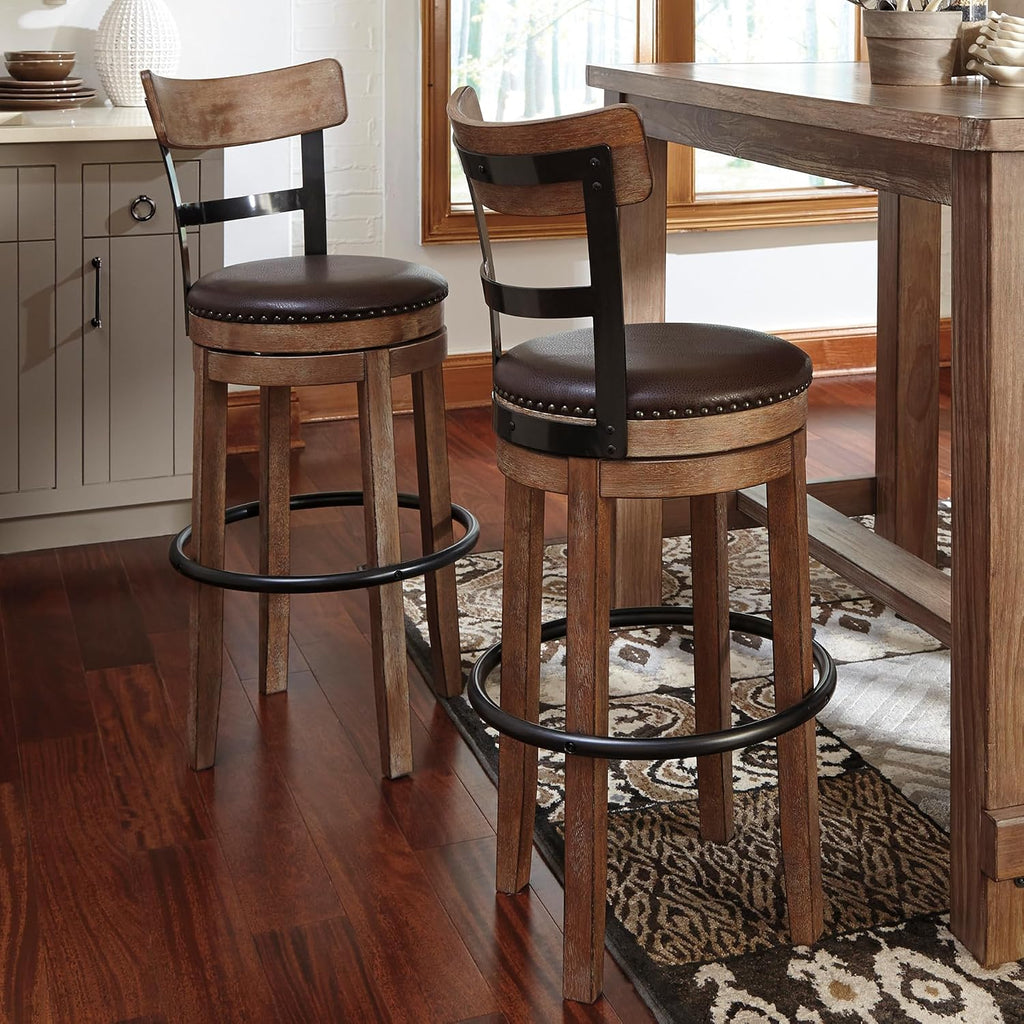 Signature Design by Ashley Pinnadel 30" Swivel Bar Height Barstool, Brown | Faux leather padded seat for easy cleanup, Sturdy wood, engineered wood, and metal frame, Built-in comfort footrest