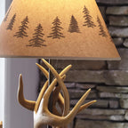 Signature Design by Ashley Derek Rustic Table Lamps, Living Room, Set of 2 | Durable poly resin antler base, Warm translucent paper silhouette shade projecting forest scenes, Rustic cabin style